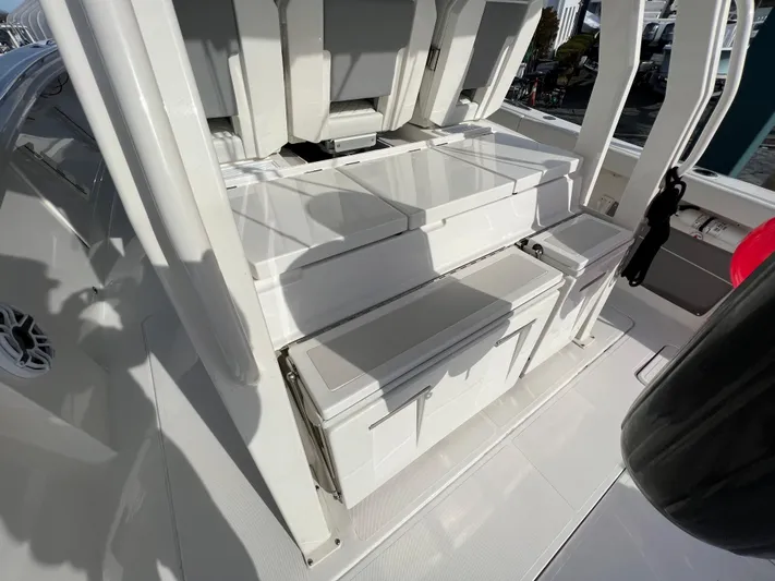  Yacht Photos Pics 2022 Pursuit S 358 boat interior with sleek seating and storage compartments.