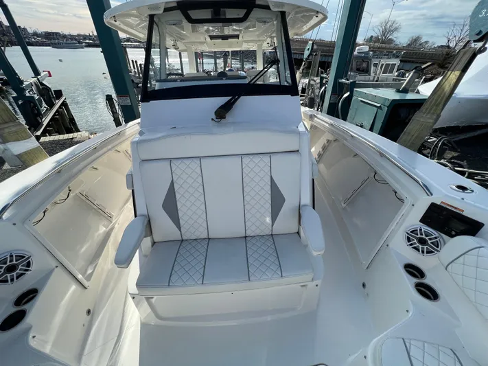  Yacht Photos Pics 2022 Pursuit S 358 boat interior with white seating and modern design.