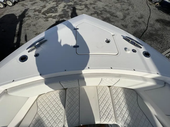  Yacht Photos Pics 2022 Pursuit S 358 boat bow with quilted seating and deck hatch.