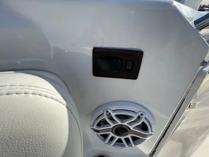  Yacht Photos Pics Interior of 2022 Pursuit S 358 boat with speaker and control panel.