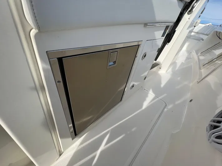  Yacht Photos Pics 2022 Pursuit S 358 boat interior with sleek storage compartment.