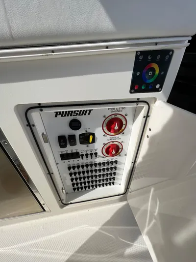  Yacht Photos Pics Control panel of 2022 Pursuit S 358 boat with color-coded switches and dials.