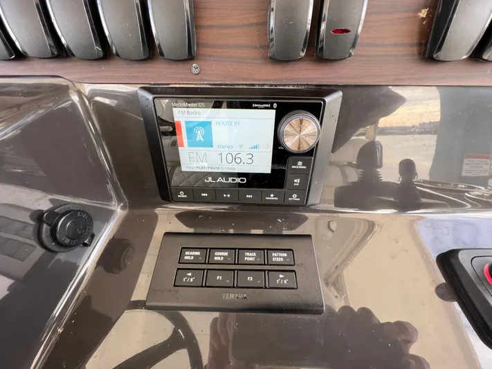  Yacht Photos Pics 2022 Pursuit S 358 dashboard with JL Audio system and control panel.