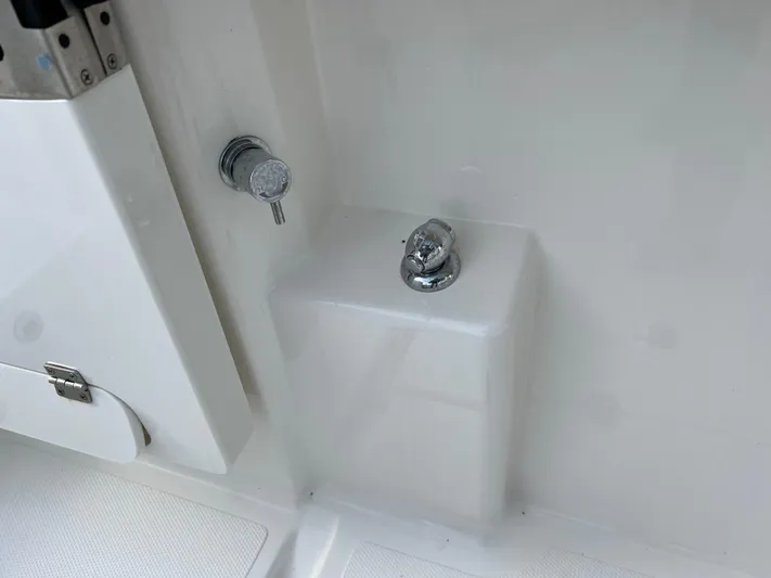  Yacht Photos Pics 2022 Pursuit S 358 boat interior detail with chrome fixtures.