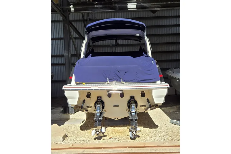 Famous Sport Boat Vibe Yacht Photos Pics 2016 Formula 330 Crossover Bowrider, rear view, covered, in storage.