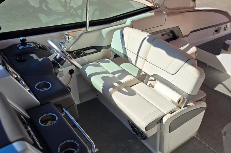 Famous Sport Boat Vibe Yacht Photos Pics 2016 Formula 330 Crossover Bowrider cockpit with white seating and modern controls.