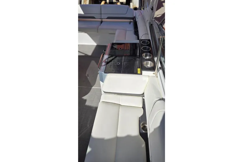 Famous Sport Boat Vibe Yacht Photos Pics 2016 Formula 330 Crossover Bowrider interior with white seating and cup holders.