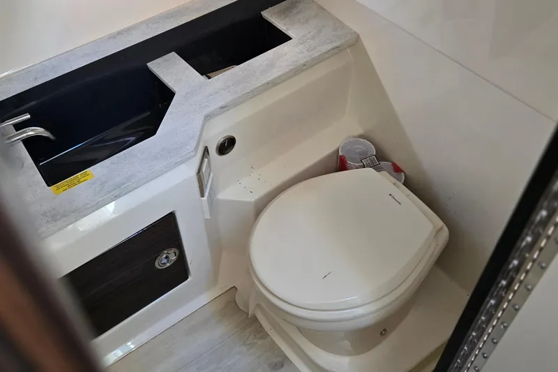 Famous Sport Boat Vibe Yacht Photos Pics 2016 Formula 330 Crossover Bowrider bathroom with sink and toilet.