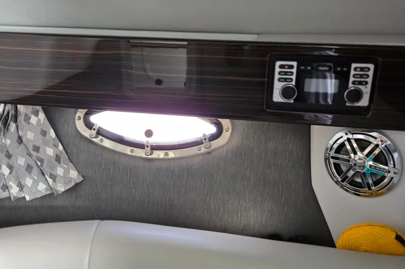 Famous Sport Boat Vibe Yacht Photos Pics Interior of 2016 Formula 330 Crossover Bowrider with porthole, speaker, and control panel.