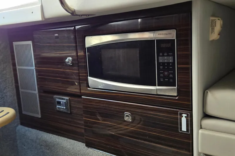 Famous Sport Boat Vibe Yacht Photos Pics 2016 Formula 330 Crossover Bowrider interior with built-in Frigidaire microwave.