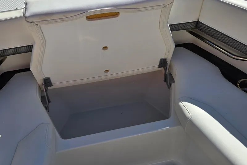 Famous Sport Boat Vibe Yacht Photos Pics 2016 Formula 330 Crossover Bowrider storage compartment with open lid, showcasing interior space.