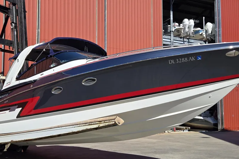 Famous Sport Boat Vibe Yacht Photos Pics 2016 Formula 330 Crossover Bowrider in storage, featuring sleek design and vibrant colors.