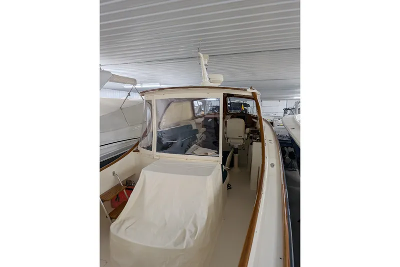 Lady K Yacht Photos Pics 2005 Hinckley Picnic Boat 36 Classic EP in storage, showcasing elegant design and craftsmanship.