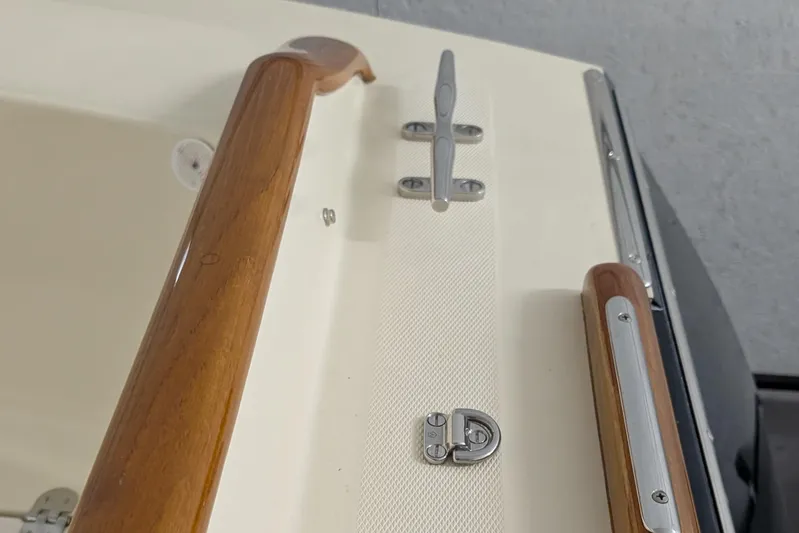 Lady K Yacht Photos Pics 2005 Hinckley Picnic Boat 36 Classic EP deck with wooden handrails and metal fittings.