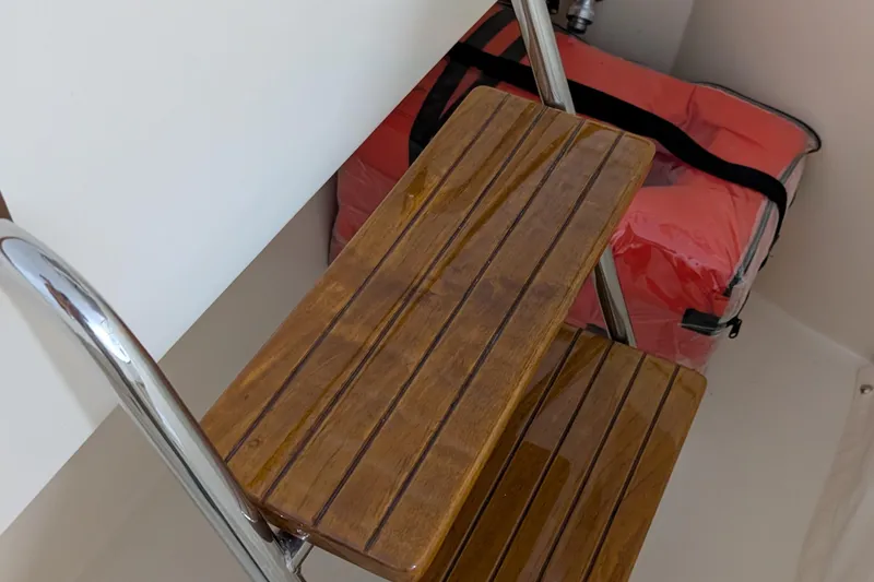 Lady K Yacht Photos Pics Wooden steps and a red life jacket on a 2005 Hinckley Picnic Boat 36 Classic EP.