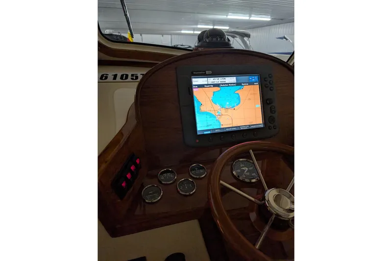 Lady K Yacht Photos Pics Helm of 2005 Hinckley Picnic Boat 36 Classic EP with navigation display and gauges.