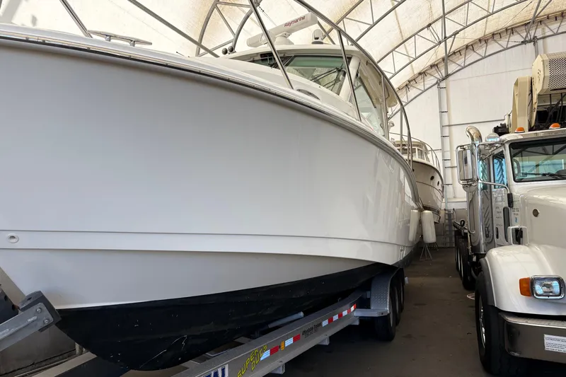 Amy Yacht Photos Pics 2018 Boston Whaler 345 Conquest boat on trailer in storage facility.
