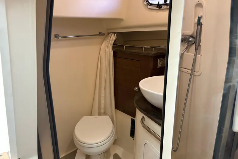 Amy Yacht Photos Pics 2018 Boston Whaler 345 Conquest bathroom with toilet, sink, and showerhead.