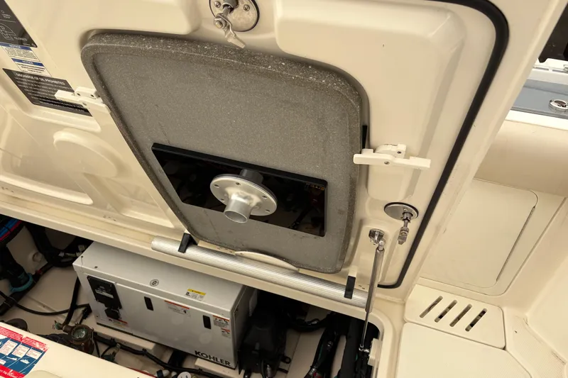 Amy Yacht Photos Pics Engine compartment of a 2018 Boston Whaler 345 Conquest boat, featuring a Kohler generator.