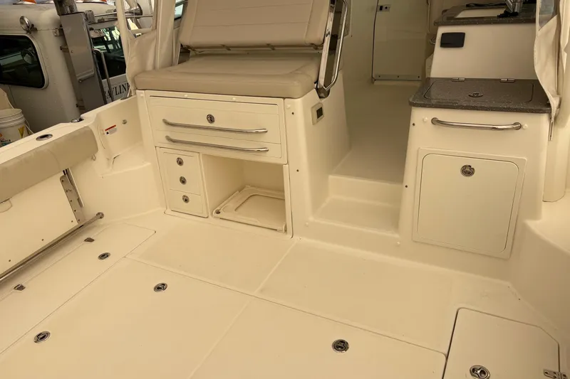 Amy Yacht Photos Pics 2018 Boston Whaler 345 Conquest interior with seating, storage, and counter space.
