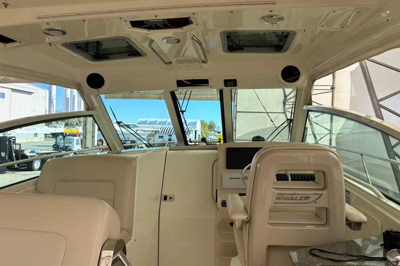 Amy Yacht Photos Pics 2018 Boston Whaler 345 Conquest interior with helm and seating area.