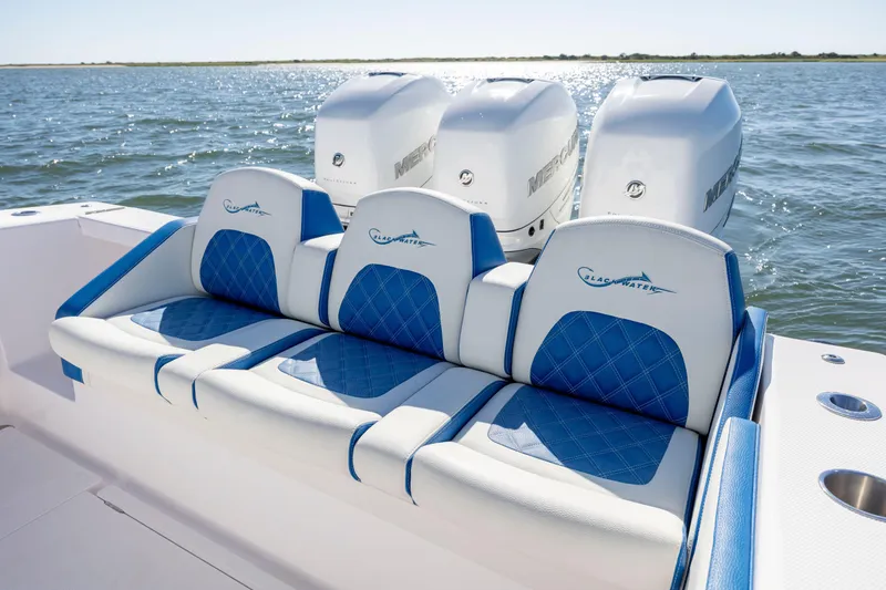  Yacht Photos Pics 2022 Blackwater 36 Sport boat with blue and white seating, triple Mercury engines.
