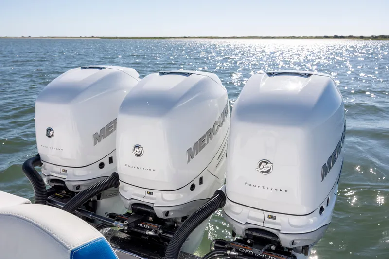  Yacht Photos Pics Triple Mercury outboard engines on a 2022 Blackwater 36 Sport boat in open water.