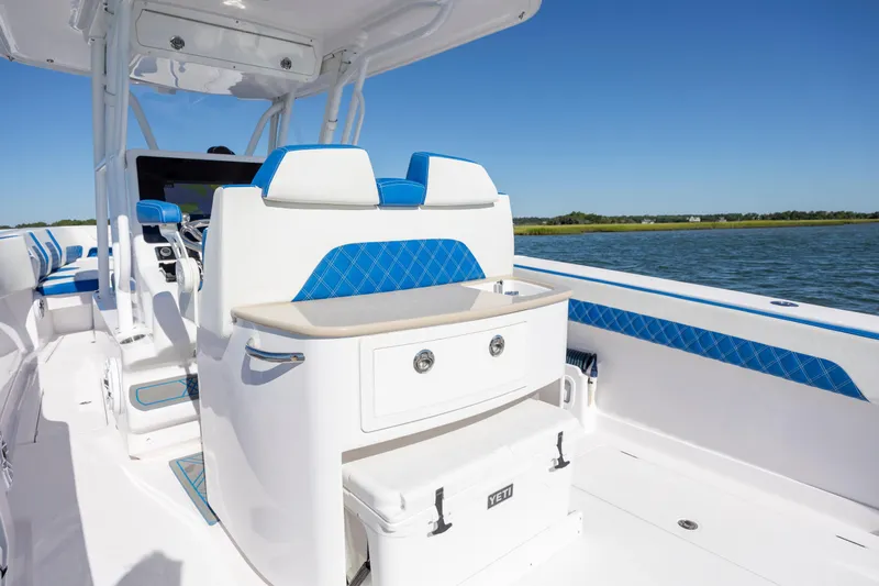  Yacht Photos Pics 2022 Blackwater 36 Sport boat interior with blue accents on a sunny day.