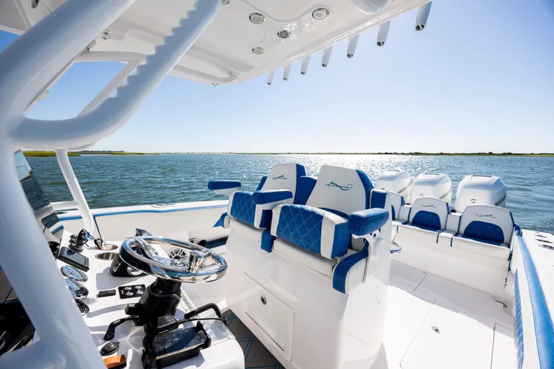  Yacht Photos Pics 2022 Blackwater 36 Sport boat interior with blue seating on open water.