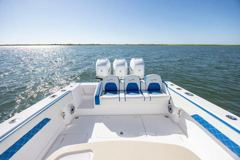  Yacht Photos Pics 2022 Blackwater 36 Sport boat with triple engines on open water.