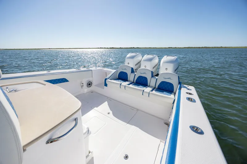  Yacht Photos Pics 2022 Blackwater 36 Sport boat with triple engines on open water, featuring luxurious seating.