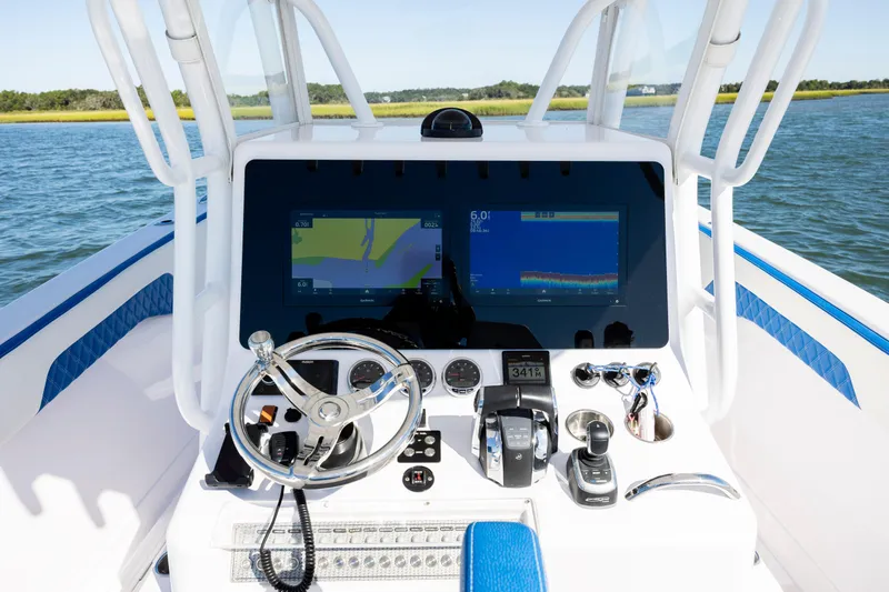  Yacht Photos Pics Control panel of 2022 Blackwater 36 Sport boat with navigation screens and steering wheel.