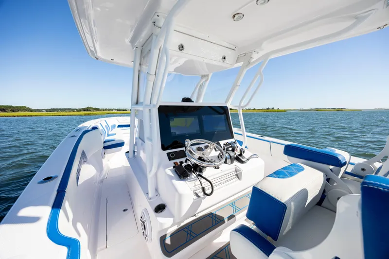  Yacht Photos Pics 2022 Blackwater 36 Sport boat interior with blue accents on a sunny day.
