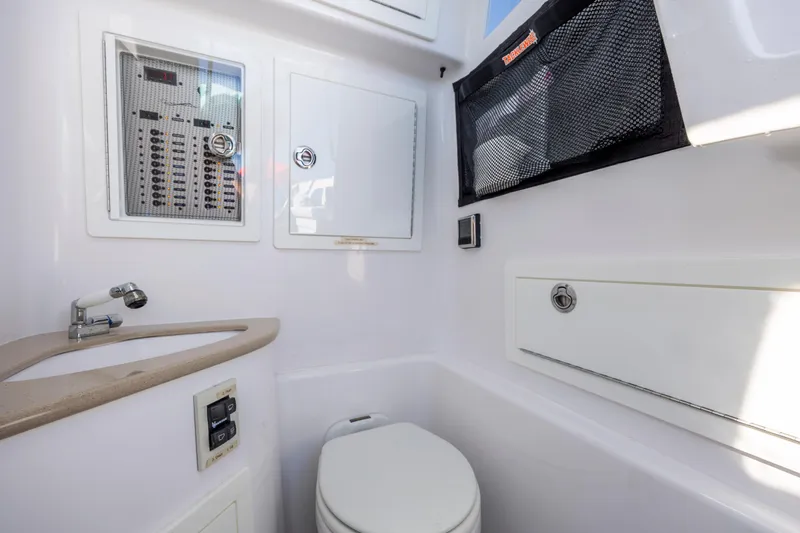  Yacht Photos Pics 2022 Blackwater 36 Sport boat interior with sink, toilet, and storage compartments.