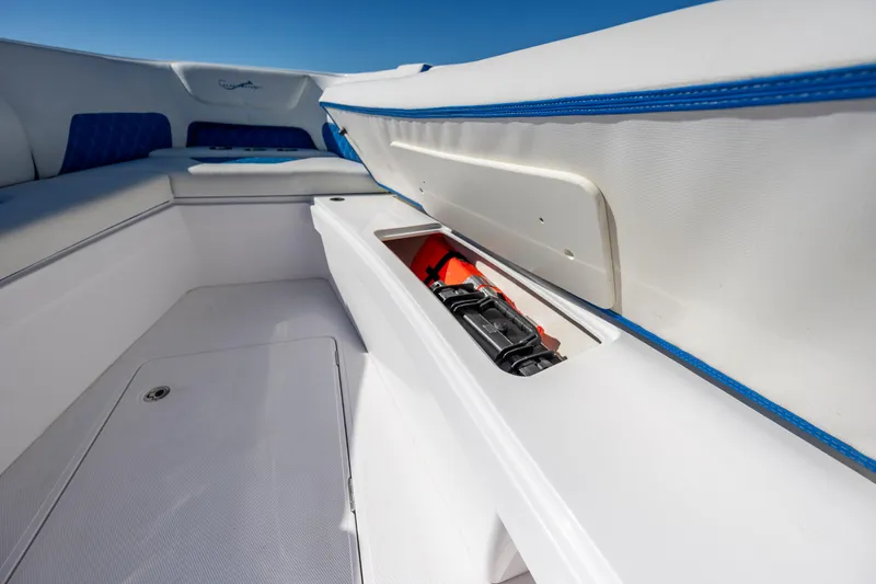  Yacht Photos Pics 2022 Blackwater 36 Sport boat interior with open storage compartment and seating.