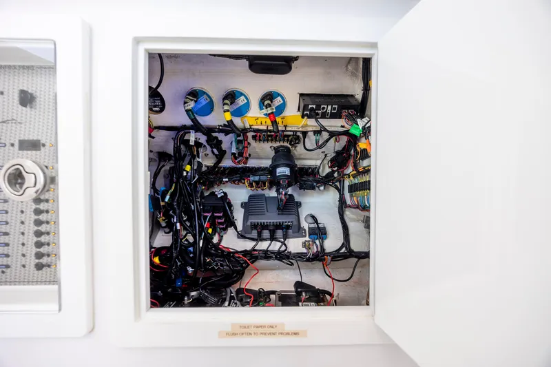 Yacht Photos Pics Electrical panel inside a 2022 Blackwater 36 Sport boat, showcasing intricate wiring and components.