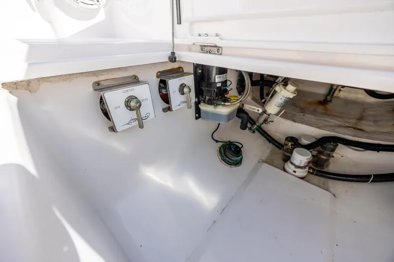  Yacht Photos Pics 2022 Blackwater 36 Sport boat interior showing control switches and mechanical components.