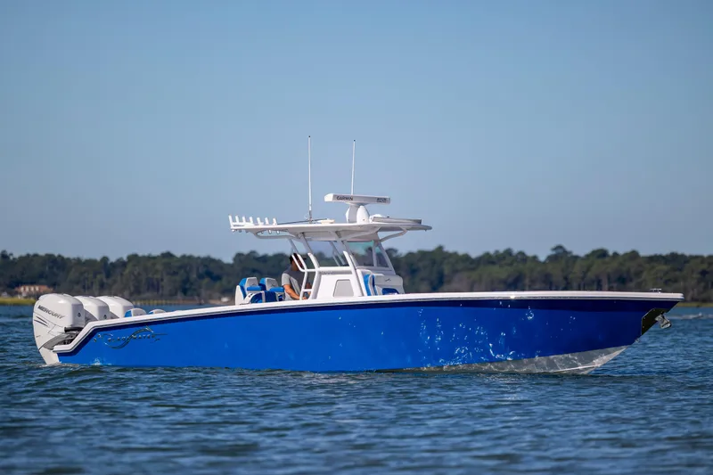  Yacht Photos Pics 2022 Blackwater 36 Sport boat on water, featuring sleek blue design and powerful engines.