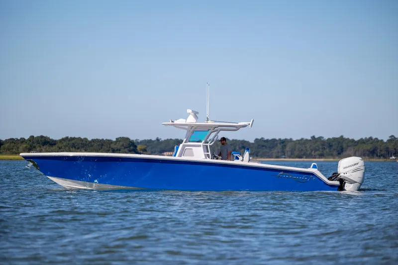  Yacht Photos Pics 2022 Blackwater 36 Sport boat cruising on a calm lake under clear skies.