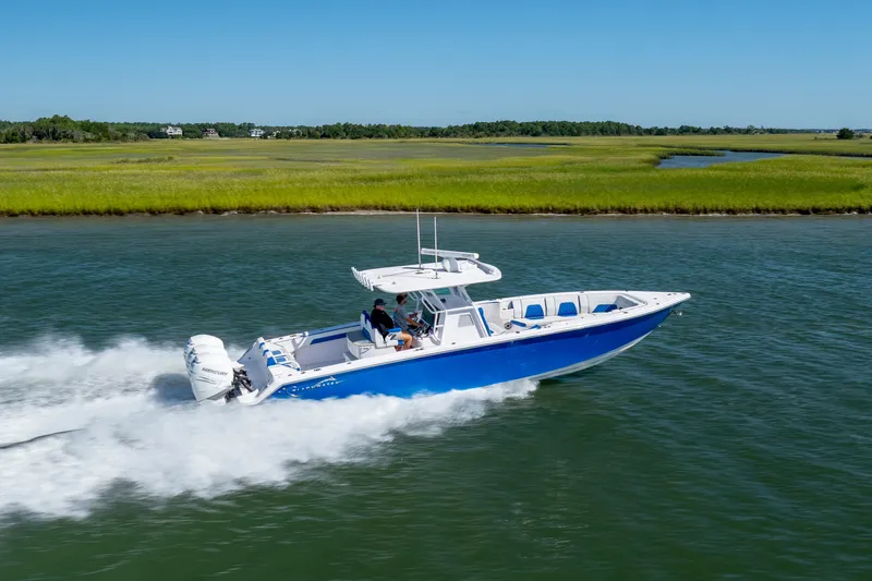  Yacht Photos Pics 2022 Blackwater 36 Sport boat cruising on a scenic waterway.