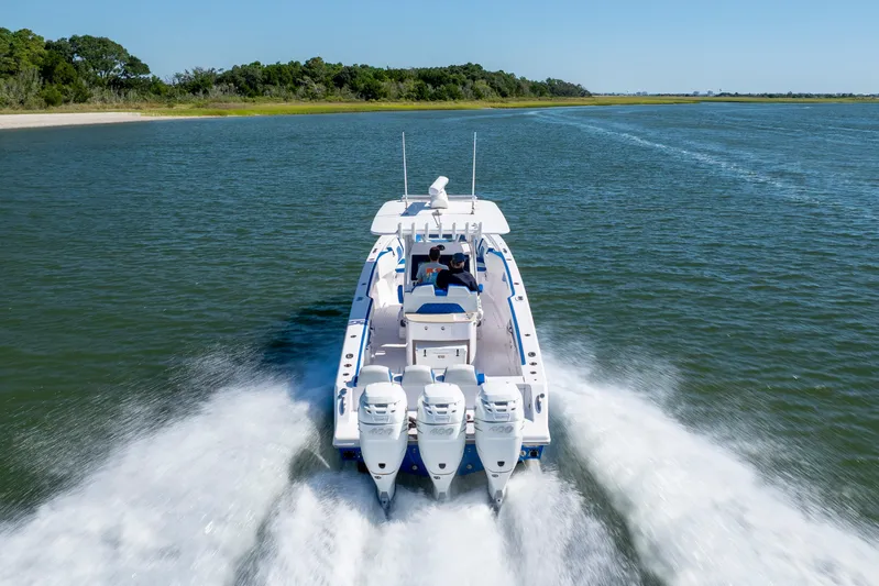  Yacht Photos Pics 2022 Blackwater 36 Sport boat cruising on open water, rear view.