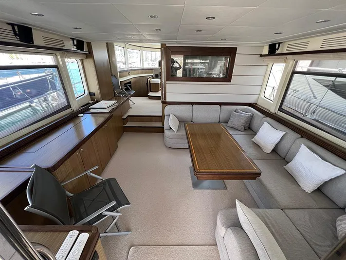  Yacht Photos Pics Luxurious interior of a 2007 Apreamare 65 yacht with elegant seating and wooden table.