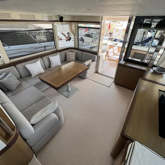  Yacht Photos Pics Luxurious interior of a 2007 Apreamare 65 yacht with elegant seating and dining area.