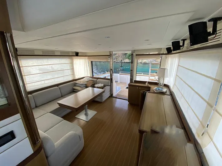  Yacht Photos Pics Luxurious interior of a 2007 Apreamare 65 yacht with elegant seating and wooden flooring.