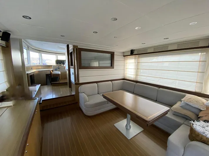  Yacht Photos Pics Luxurious interior of a 2007 Apreamare 65 yacht with elegant seating and dining area.