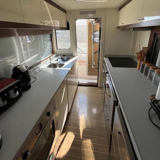 Yacht Photos Pics Luxurious kitchen interior of 2007 Apreamare 65 yacht with modern appliances and sleek design.