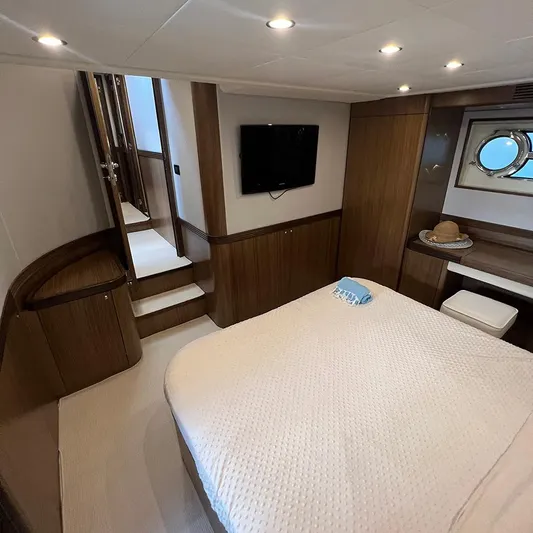  Yacht Photos Pics Luxurious bedroom interior of 2007 Apreamare 65 yacht with modern decor and cozy ambiance.