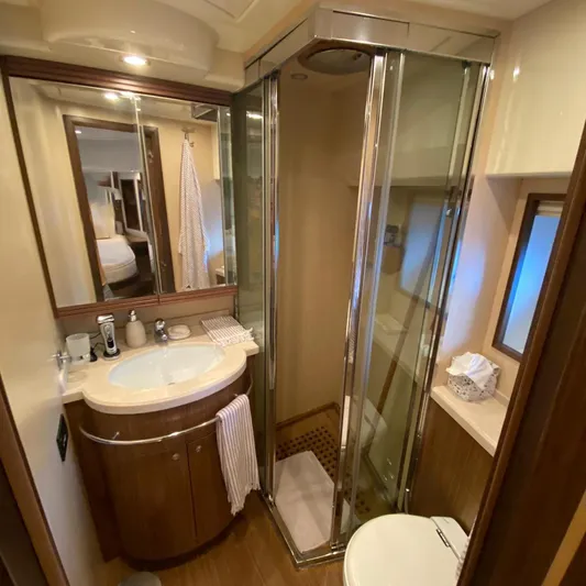  Yacht Photos Pics Luxurious bathroom in 2007 Apreamare 65 yacht with shower, sink, and mirror.