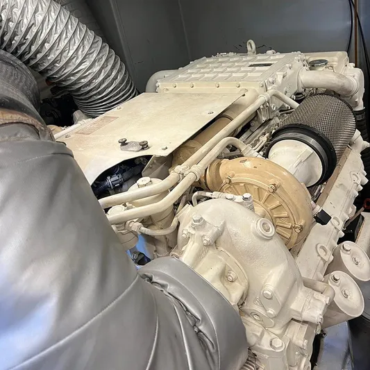  Yacht Photos Pics Engine of a 2007 Apreamare 65 yacht, showcasing mechanical components and exhaust system.