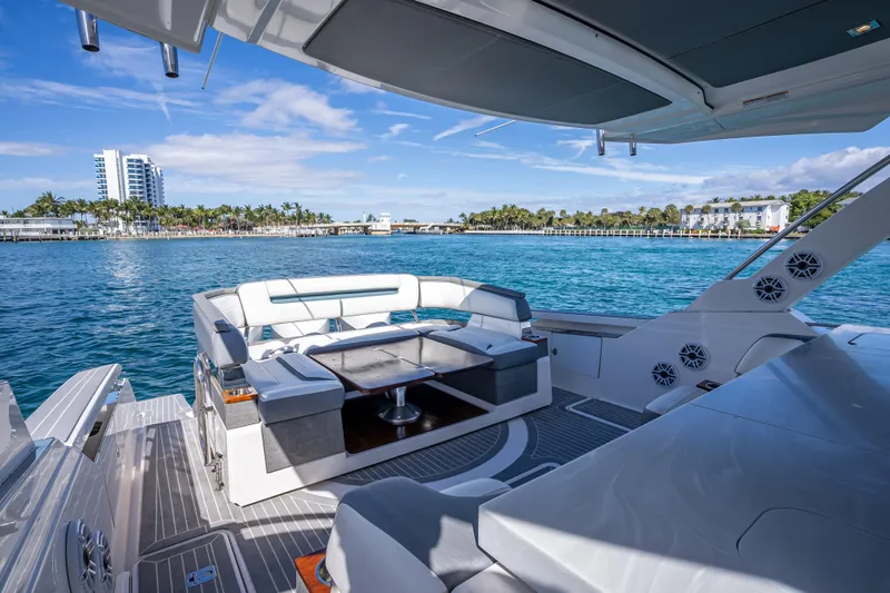  Yacht Photos Pics Luxurious 2019 Tiara Sport 38 LS yacht interior with ocean view and modern seating.